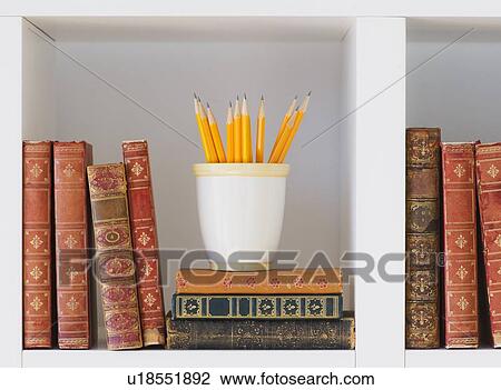 Close up of books and pencils on shelf, studio shot View Large Photo Image Stock Image - Close up of books and pencils on shelf, studio shot. Fotosearch