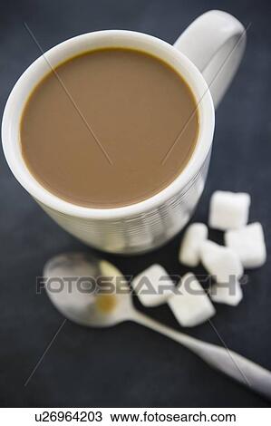 Close up of coffee cup and sugar cubes View Large Photo Image Stock Image - Close up of coffee cup and sugar cubes. Fotosearch