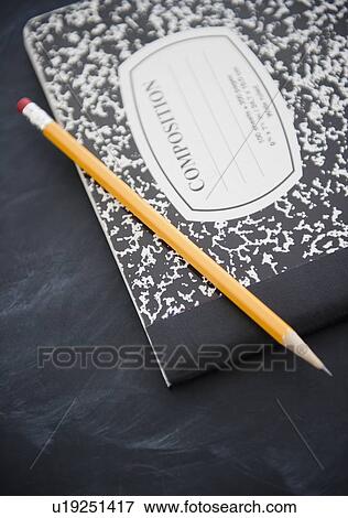 Stock Photo - Close up of composition book and pencil. Fotosearch