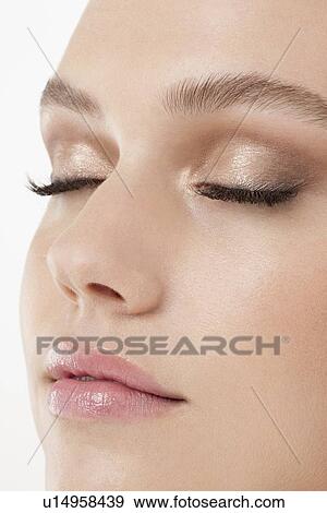 Stock Photo - Close-up of female face with subtle make-up. Fotosearch
