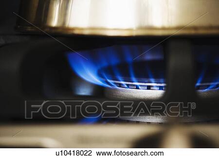 Stock Image - Close-up of gas stove burner. Fotosearch