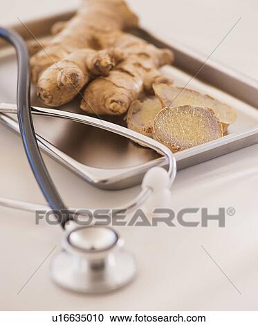 Close up of ginger root and stethoscope View Large Photo Image Stock Image - Close up of ginger root and stethoscope. Fotosearch