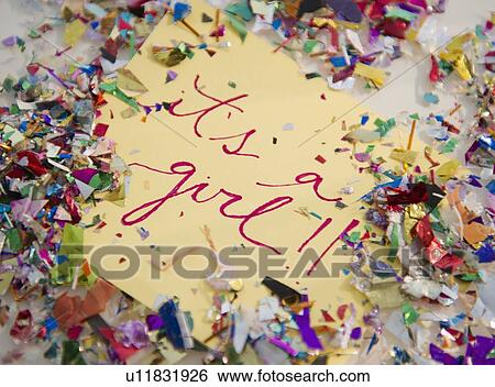Stock Photograph - Close up of greeting card with confetti. Fotosearch