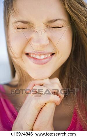 Close-up of praying woman View Large Photo Image Stock Photograph - Close-up of praying woman. Fotosearch