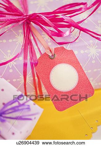 Close up of ribbon on birthday present, studio shot View Large Photo Image Stock Photo - Close up of ribbon on birthday present, studio shot. Fotosearch