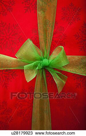 Stock Image - Close-up of ribbon on gift wrap. Fotosearch