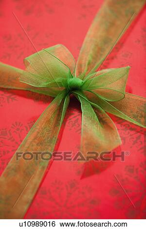 Close-up of ribbon on gift wrap View Large Photo Image Stock Photograph - Close-up of ribbon on gift wrap. Fotosearch