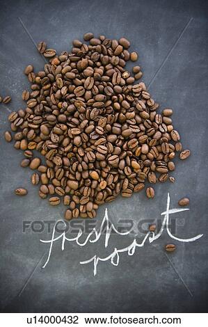 Stock Image - Close up of roast coffee beans. Fotosearch
