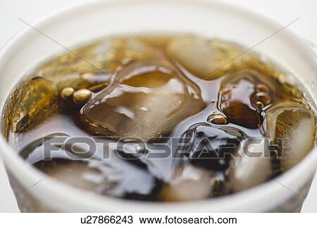 Close-up of soda in disposable cup View Large Photo Image Stock Image - Close-up of soda in disposable cup. Fotosearch