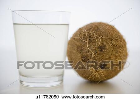 Coconut water in glass View Large Photo Image Stock Image - Coconut water in glass. Fotosearch