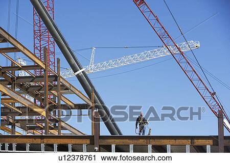 Stock Image - Construction frame and crane. Fotosearch