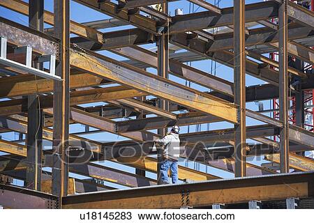 Construction worker on construction frame View Large Photo Image Stock Image - Construction worker on construction frame. Fotosearch