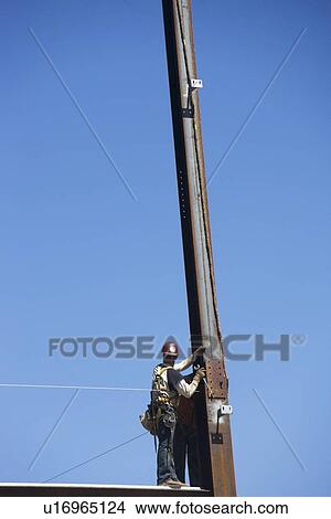 Construction workers on construction frame View Large Photo Image Picture - Construction workers on construction frame. Fotosearch