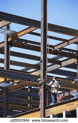 Construction workers on construction frame View Large Photo Image Picture - Construction workers on construction frame. Fotosearch