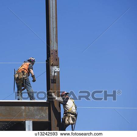 Construction workers on construction frame View Large Photo Image Stock Image - Construction workers on construction frame. Fotosearch