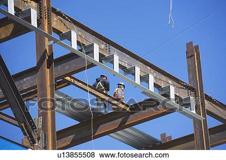 Construction workers on construction frame View Large Photo Image Stock Photo - Construction workers on construction frame. Fotosearch