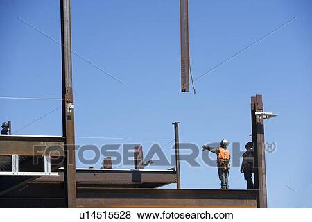 Construction workers on construction frame View Large Photo Image Stock Photo - Construction workers on construction frame. Fotosearch