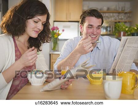 Stock Photography - Couple eating breakfast. Fotosearch