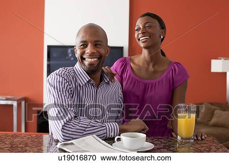 Couple enjoying breakfast at home View Large Photo Image Stock Image - Couple enjoying breakfast at home. Fotosearch