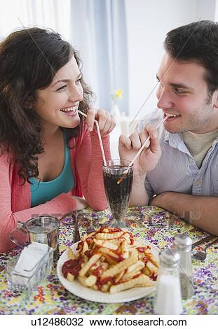 Stock Image - Couple enjoying dinner. Fotosearch
