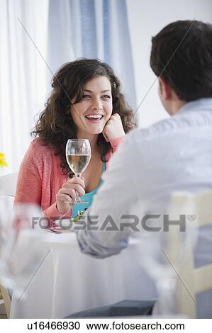 Stock Image - Couple enjoying dinner. Fotosearch