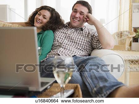 Couple watching movie on laptop View Large Photo Image Picture - Couple watching movie on laptop. Fotosearch