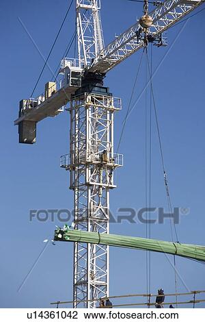 Stock Image - Crane on construction site. Fotosearch