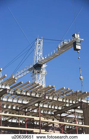 Crane on construction site View Large Photo Image Stock Image - Crane on construction site. Fotosearch