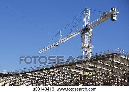 Stock Image - Crane on construction site. Fotosearch