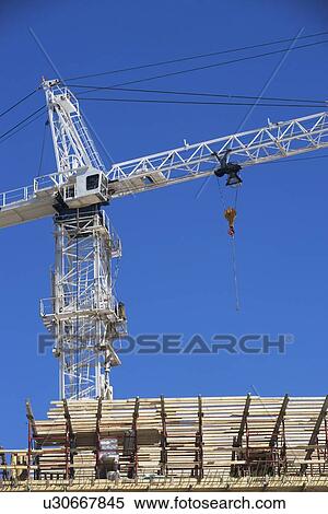 Crane on construction site View Large Photo Image Stock Photography - Crane on construction site. Fotosearch