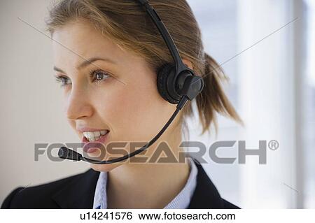 Stock Photograph - Customer service representative with headset. Fotosearch