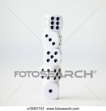Stock Image - Dices on white background, studio shot. Fotosearch