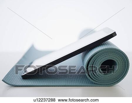Digital tablet and yoga mat View Large Photo Image Stock Photo - Digital tablet and yoga mat. Fotosearch