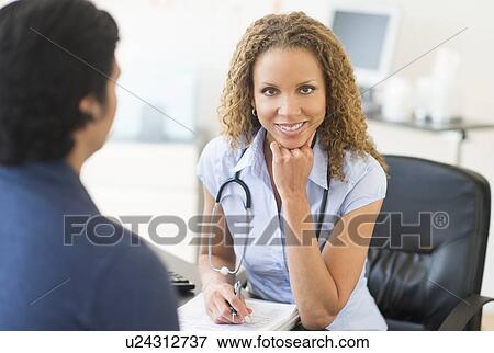 Doctor and patient in clinic View Large Photo Image Stock Photo - Doctor and patient in clinic. Fotosearch