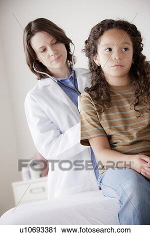 Doctor examining girl (8-9) View Large Photo Image Stock Image - Doctor examining girl (8-9). Fotosearch