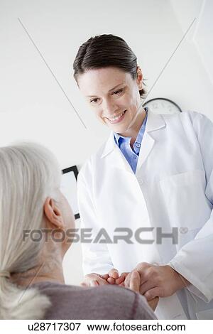 Doctor talking with senior patient View Large Photo Image Stock Photo - Doctor talking with senior patient. Fotosearch