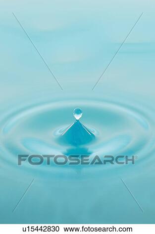 Stock Image - Drop falling into water. Fotosearch