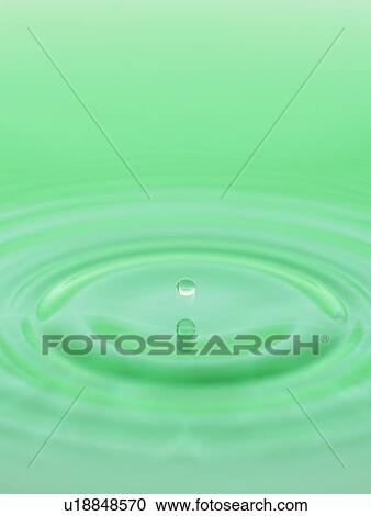 Stock Image - Drop falling into water. Fotosearch