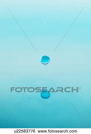 Stock Photograph - Drop falling into water. Fotosearch