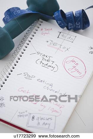 Stock Photo - Dumbbell, tape measure and to do list. Fotosearch