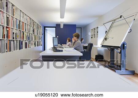 Employee of design agency at work View Large Photo Image Stock Image - Employee of design agency at work. Fotosearch