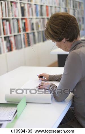 Employee of design agency at work View Large Photo Image Stock Image - Employee of design agency at work. Fotosearch