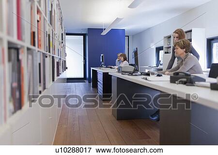 Stock Photo - Employee of design agency at work. Fotosearch