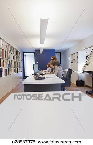 Employee of design agency at work View Large Photo Image Stock Photo - Employee of design agency at work. Fotosearch