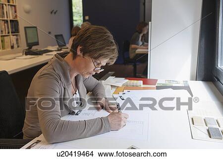 Picture - Employees of design agency at work. Fotosearch