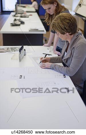Employees of design agency at work View Large Photo Image Stock Image - Employees of design agency at work. Fotosearch