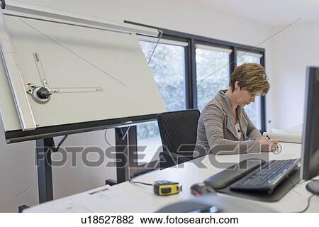 Stock Image - Employees of design agency at work. Fotosearch