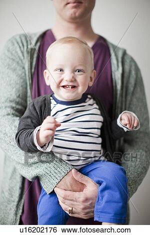 Father and toddler boy (2-3) embracing View Large Photo Image Stock Photograph - Father and toddler boy (2-3) embracing. Fotosearch