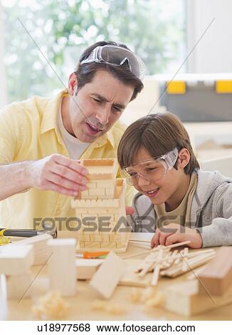 Father constructing castle with son (10-11) View Large Photo Image Stock Photo - Father constructing castle with son (10-11). Fotosearch