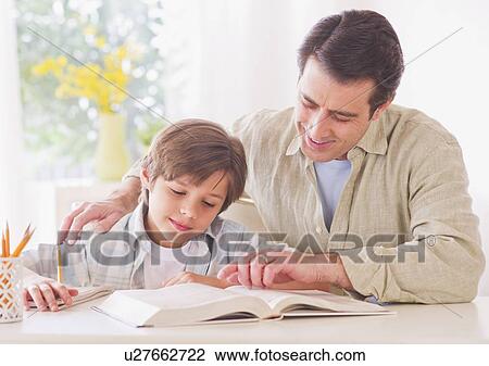 Father helping son (10-11 years) with his homework View Large Photo Image Stock Image - Father helping son (10-11 years) with his homework. Fotosearch